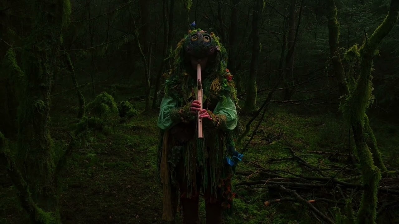 MOG is playing the Flute in the forest.