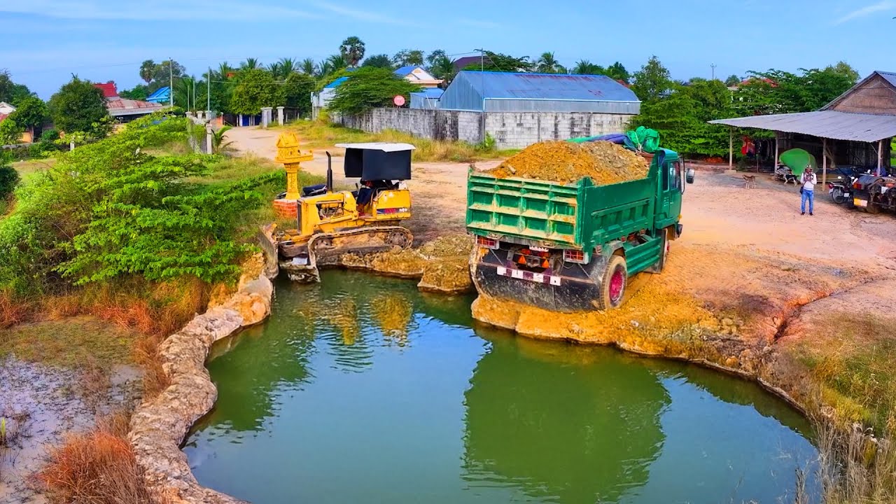 incredible delete pond landfill build factory , truck transport with bulldozer push soil to water