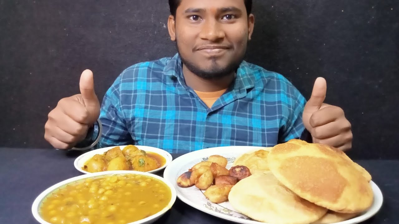 Bigbite Eating With Kachori, Chhola And Aalu Ka Sabji 
