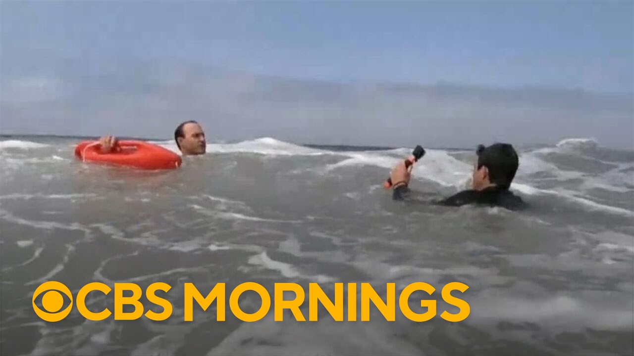 Lifeguards demonstrate how to escape from a rip current