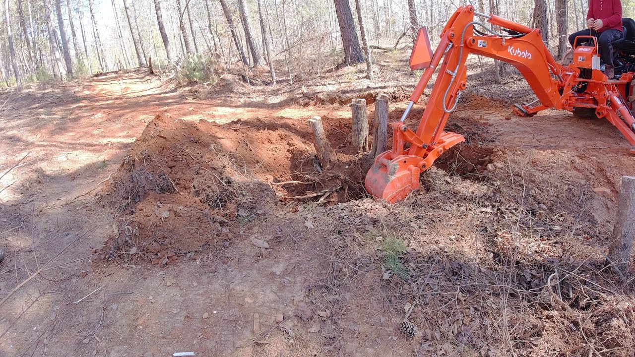 Digging out stumps with the Kubota BH92 Backhoe