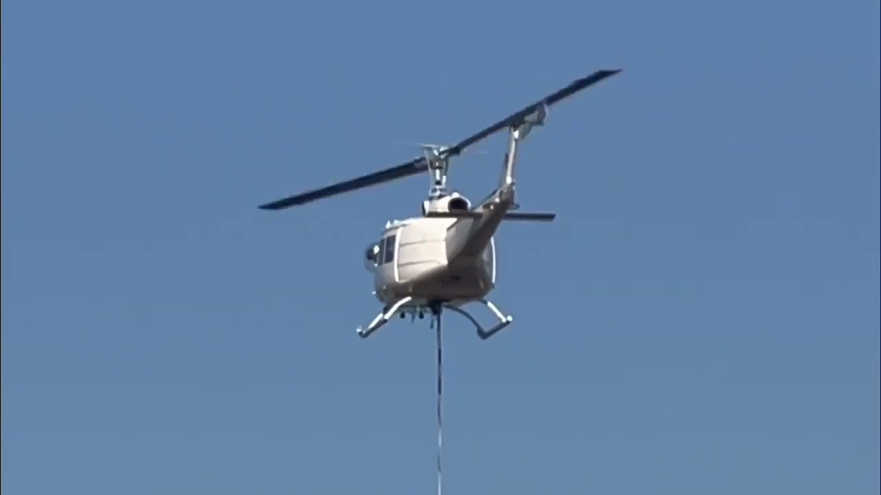 That sound! Heli-Central UH-1H Huey Helicopter VH-OXU Landing at Gladstone Airport with Water Bucket