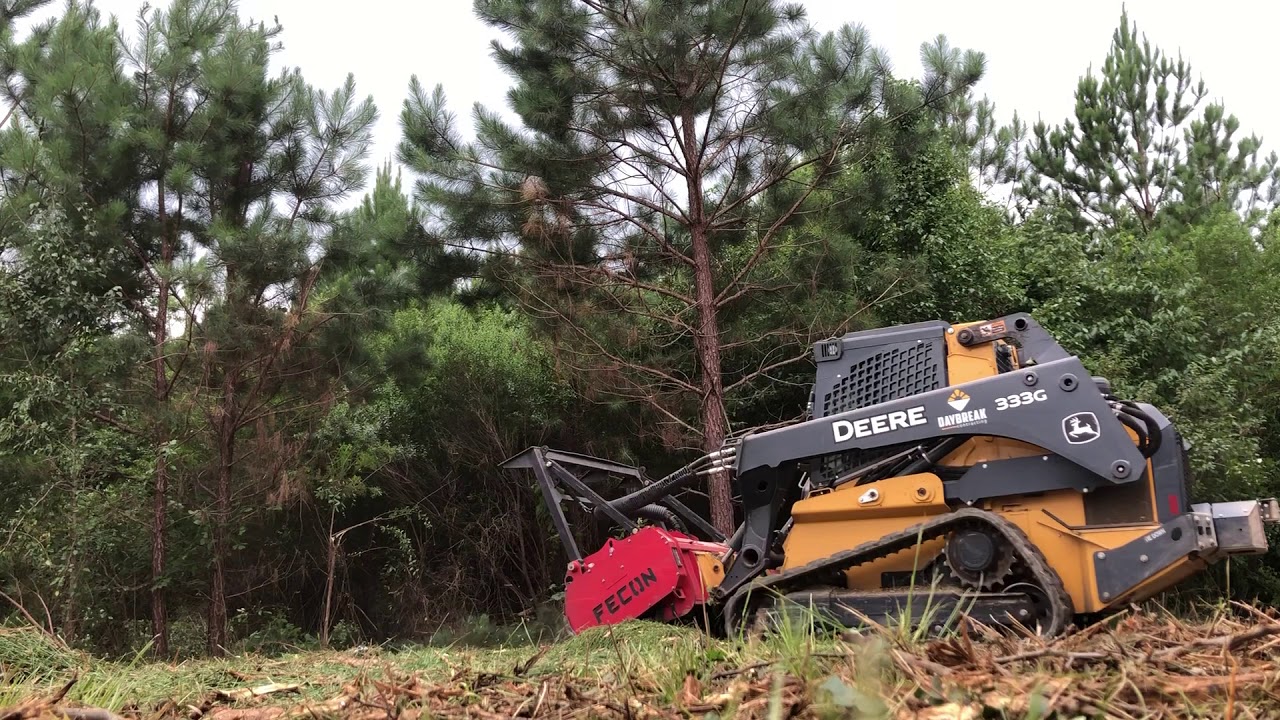 John Deere 333g with Fecon Bullhog making short work of some pine trees.