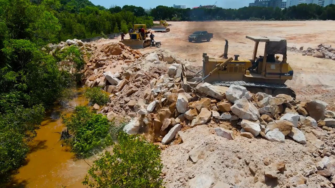 Awesome Huge Land Filling Up Processing Operator Bulldozer Moving Stone Leveling Deep in Ground