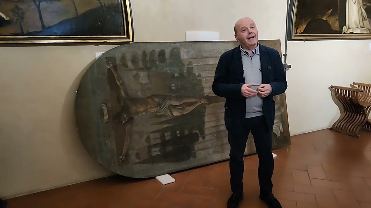 Angelo Tartuferi sulla tela di Piero del Pollaiolo prima del restauro, 2 febbraio 2023