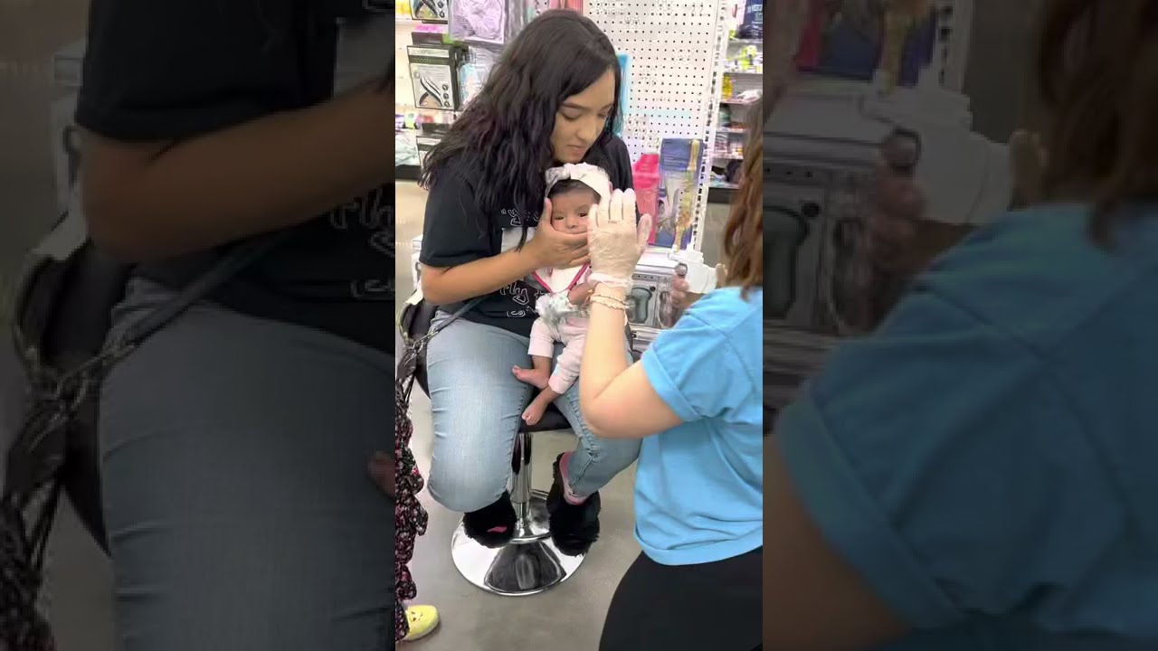 Baby Nevaeh getting her ears pierced. 😊❤️