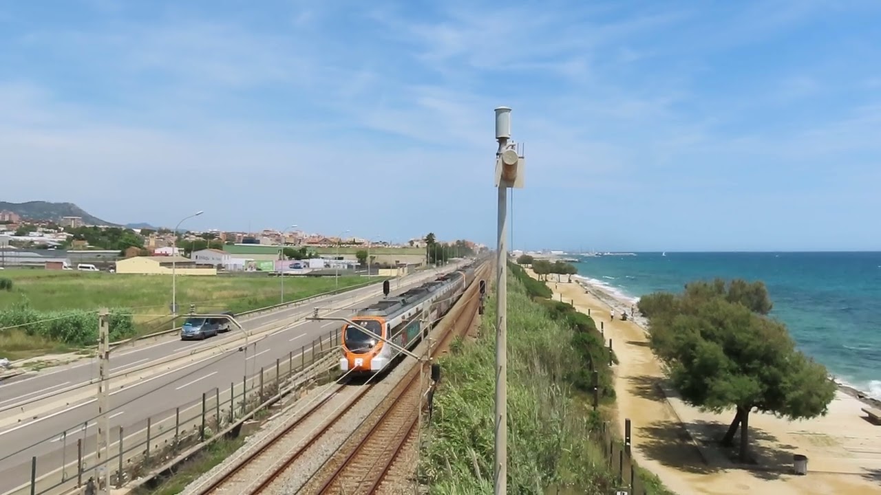 Spain: Barcelona bound Rodalies de Catalunya near Ocata (east of Barcelona) 06/06/24