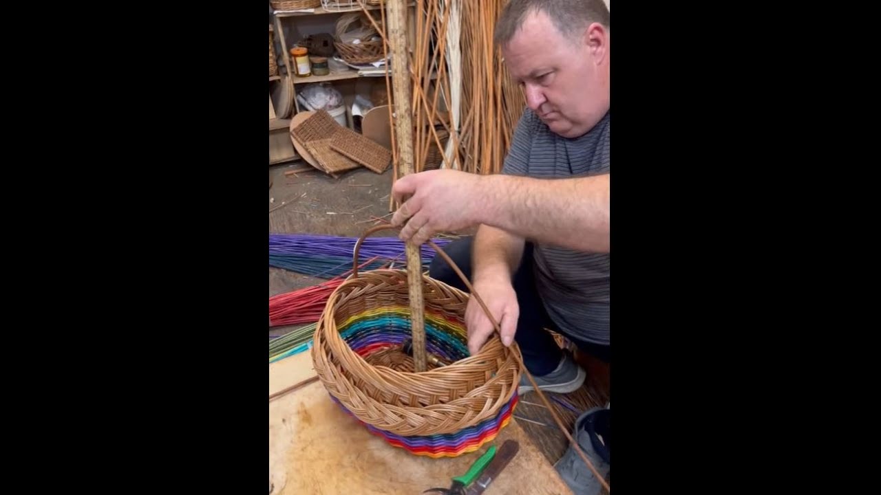 Adding a handle to a rainbow shopping basket.