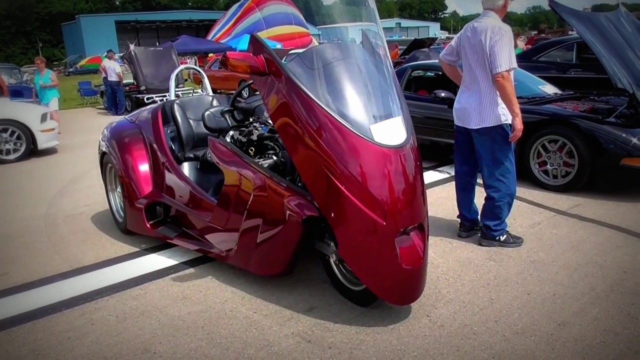 Thoroughbred Motorsports Stallion Trike Enclosed Motorcycle with a Steering Wheel.