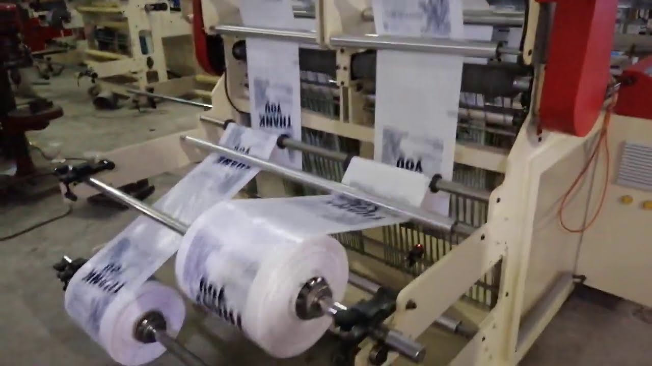 Double Line Bottom Sealing and Cold Cutting Bag Making Machine with Carry Bag Punch on Both Side
