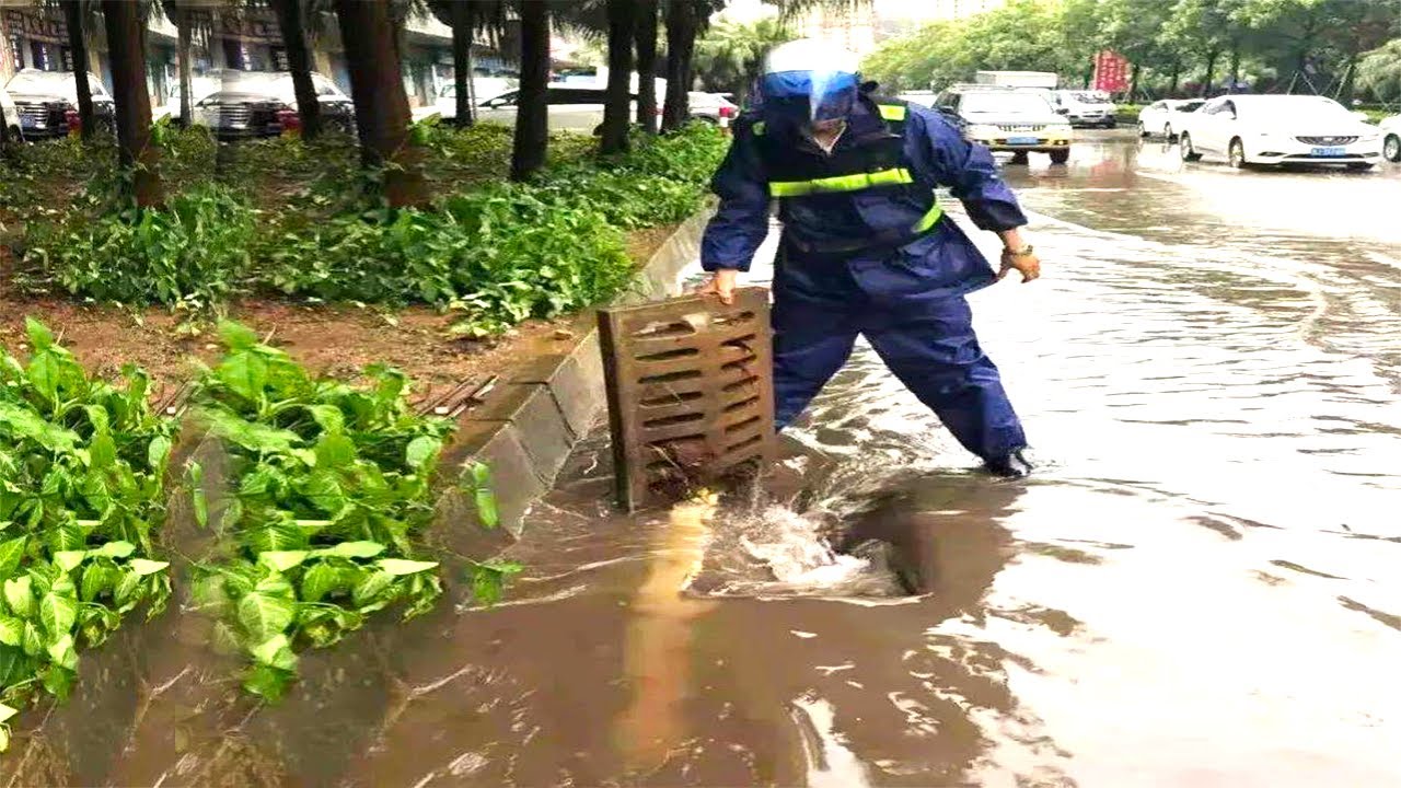 Drain Heroes Clearing Street Drains to Combat Bad Floods Post-Heavy Rain!