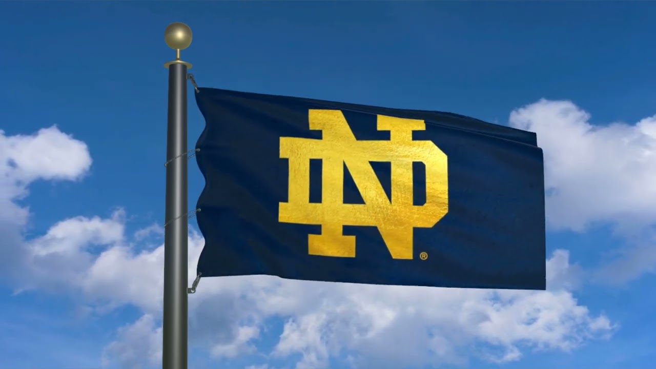 Flag of Notre Dame Fighting Irish waving in the wind (moving clouds)