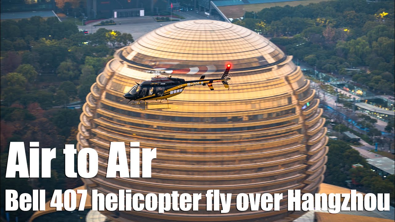 Air-to-air photography: Bell 407 helicopter flies over Hangzhou