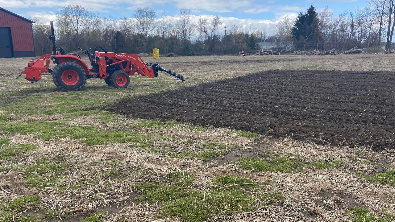 Making a garden with the Kubota L3902 land pride tiller and loader mounted hydraulic auger!