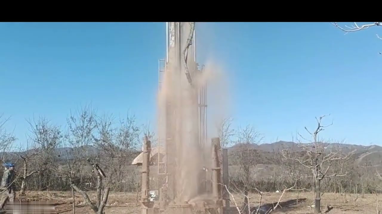 The Large Pneumatic Drilling Rig Drills 200m Deep One Day For The Mountain Top Orchard.