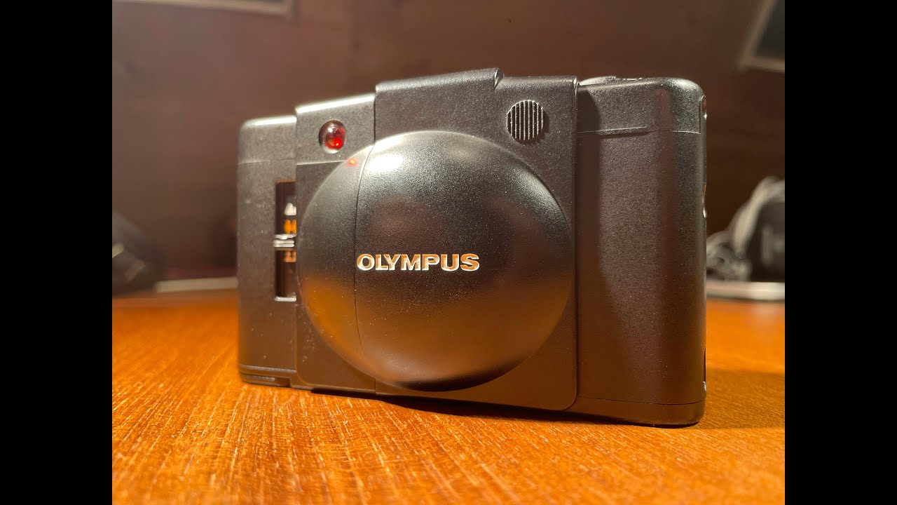 Как пользоваться Olympus XA2, как загружать и извлекать пленку и основные функции.