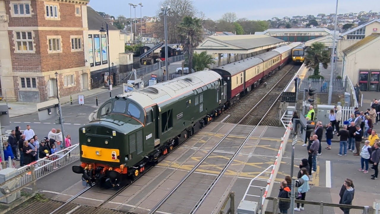 Tourists watch as Class 37s cross road in Paignton 🚜 🌊