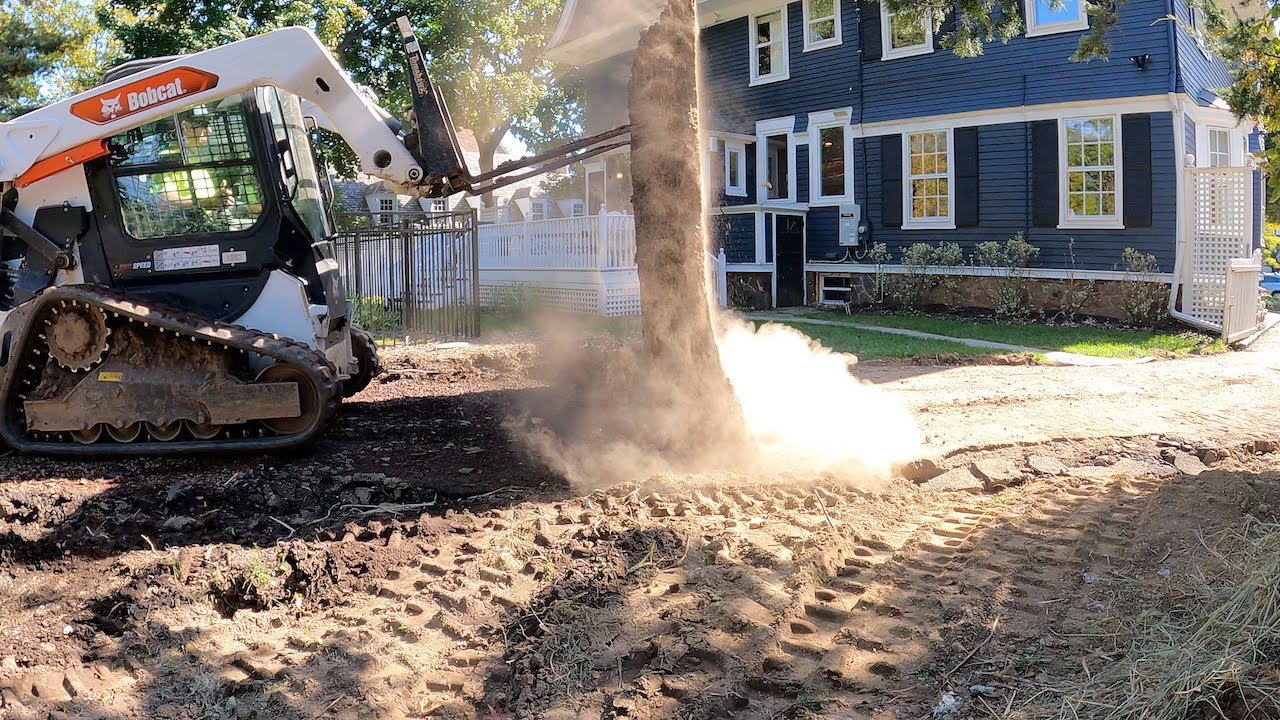 Tearing out an asphalt driveway
