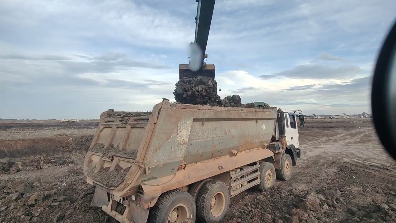 Excavator loading soil..