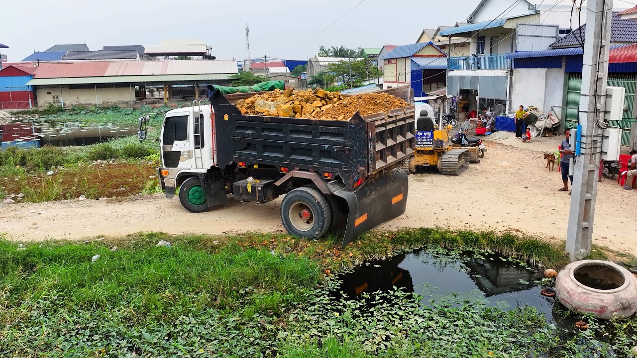 incredible skill work project landfill clear land flooded , truck transport , bulldozer push soil