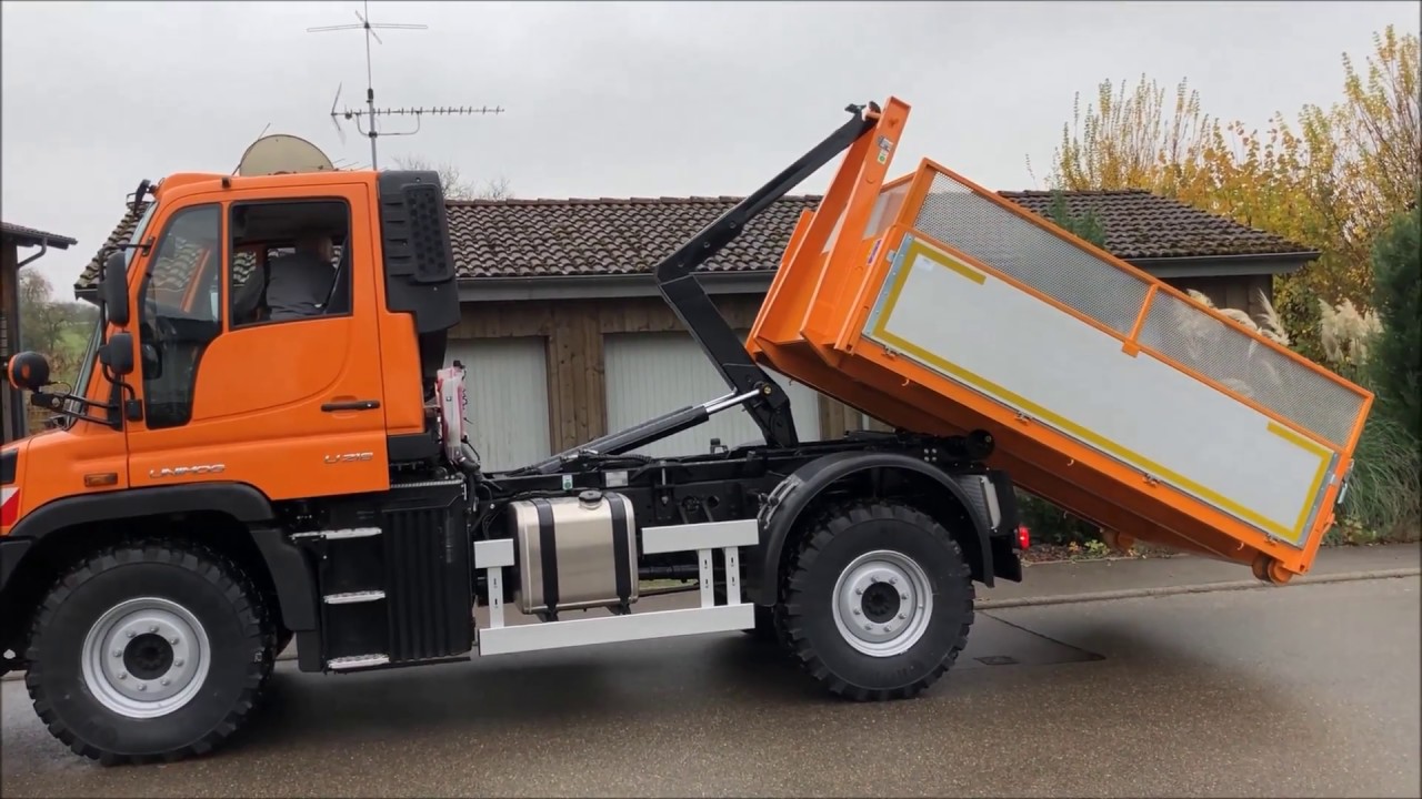 Unimog U218 mit HEN-AG Abrollcontainersystem und bema Kehrbesen