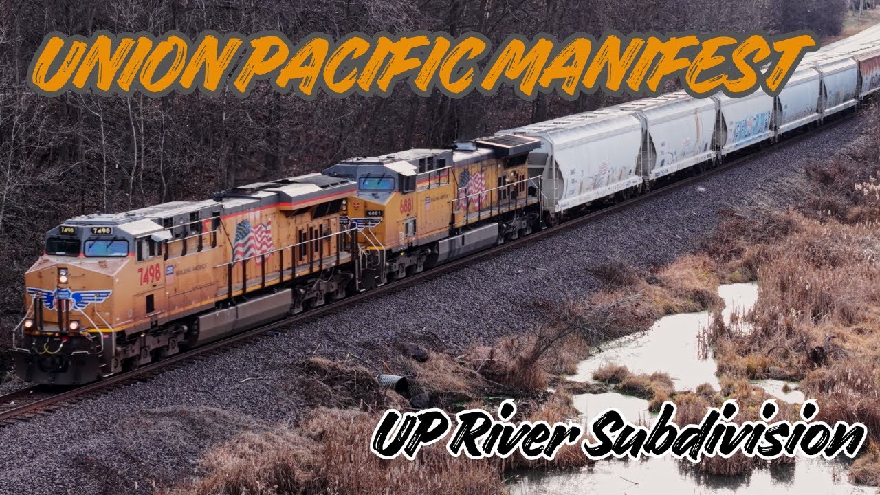 Manifest moving at track speed along the Missouri River on the Union Pacific River Sub