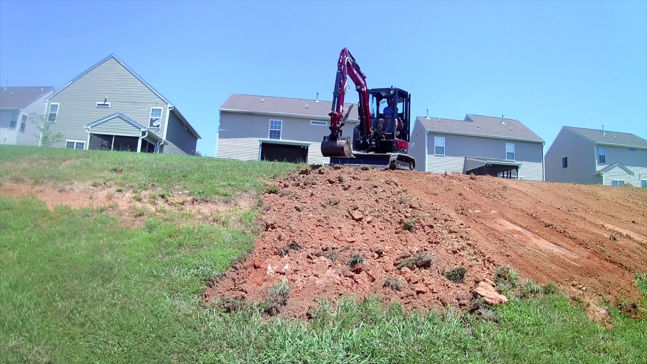 Fixed Washed Out Slope & Installed Errosion Control #errosioncontrol #sv40 #grading #excavation