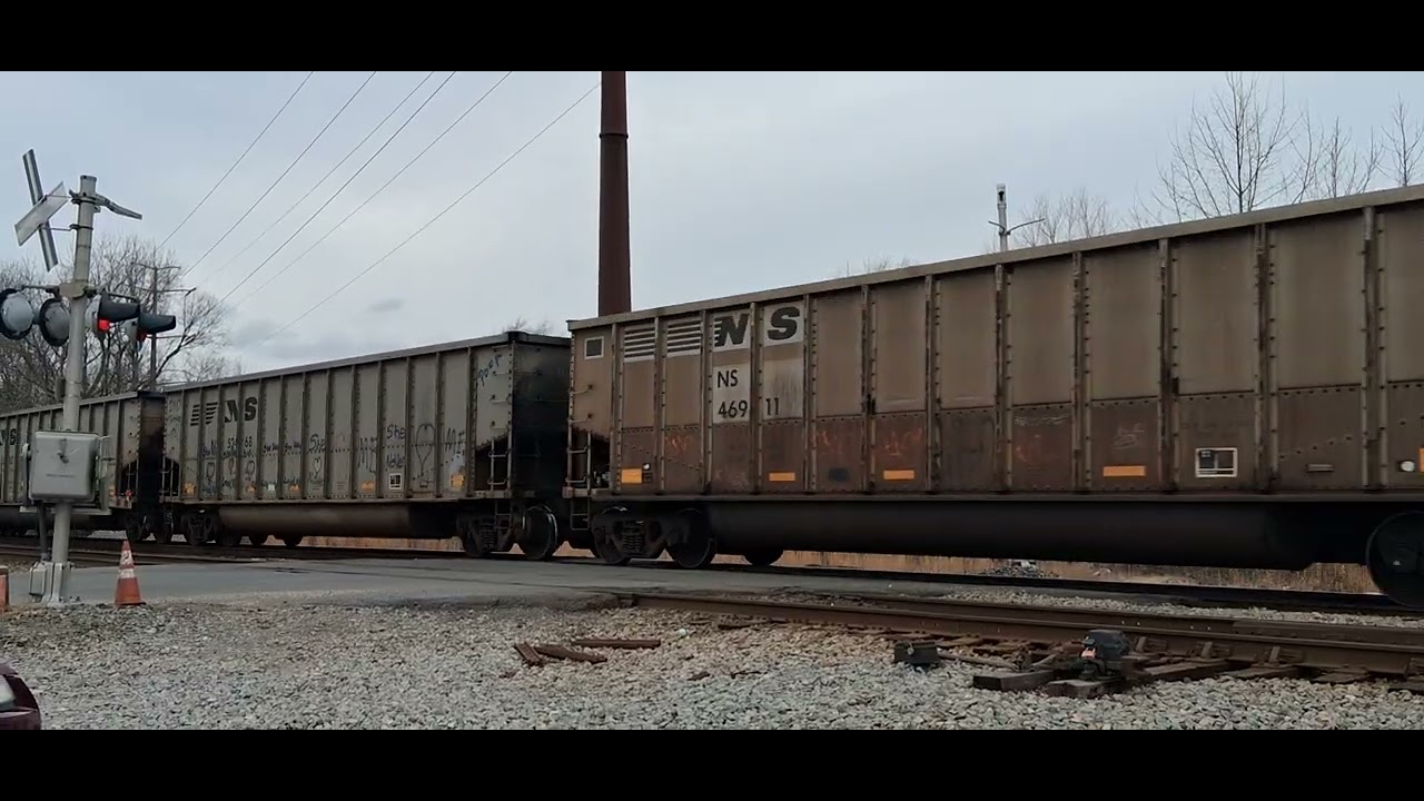 NS empty hopper train crosses shell road