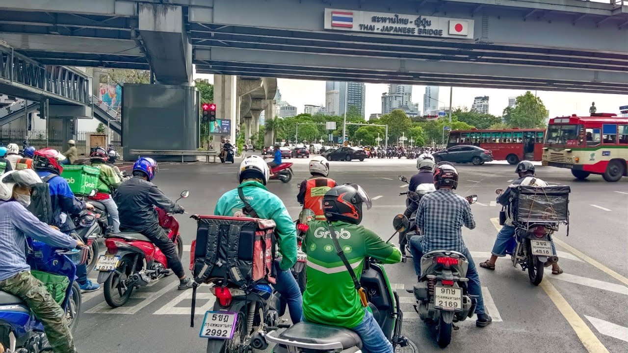 Riding a motorcycle in Bangkok, traffic jam