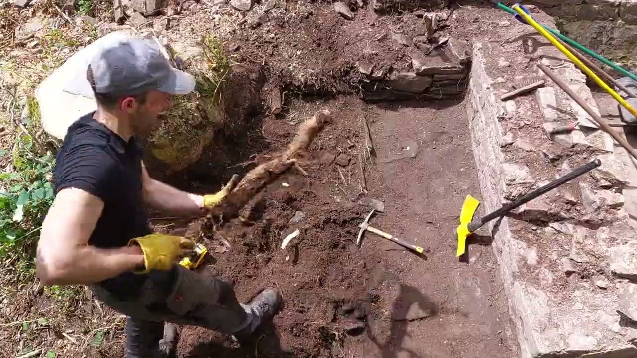 Excavating the front of the building ruins