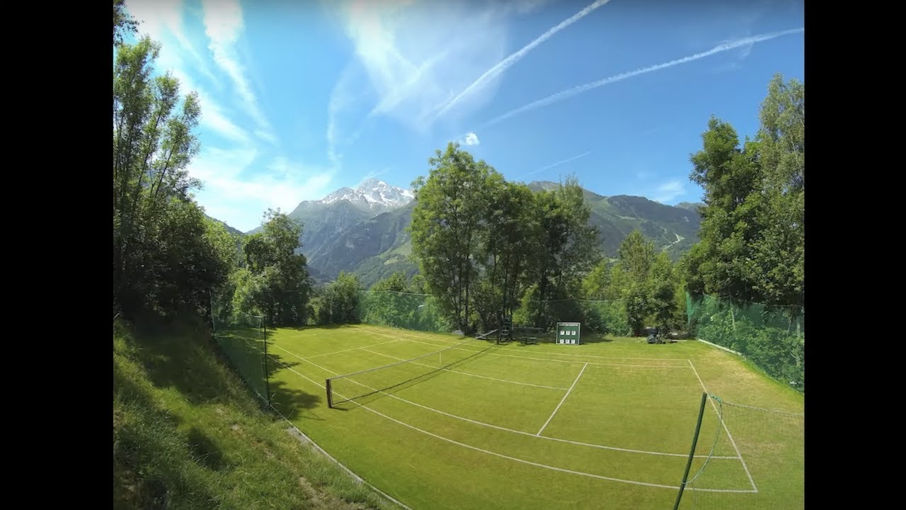I built a grass tennis court in the Alps. Intensive DIY project that WAS worth it in the end !