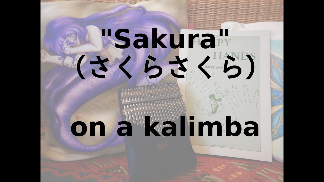 "Sakura" (さくらさくら) - Playing a kalimba (also called "mbira" or "finger harp") for the first time