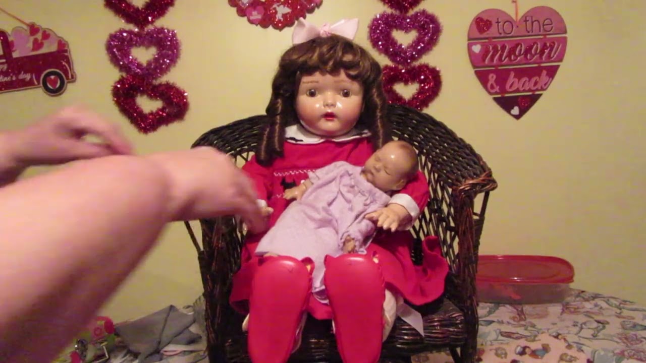 She is big and she is a singing Dolly Rekord - the broken doll