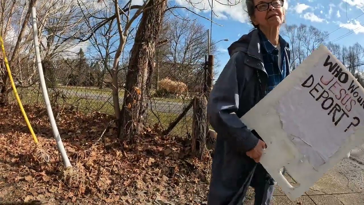 Talking to a protester about her signs on February 20,2026