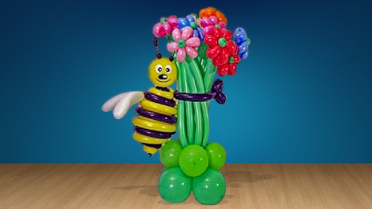 Bee with bouquet of balloons.
