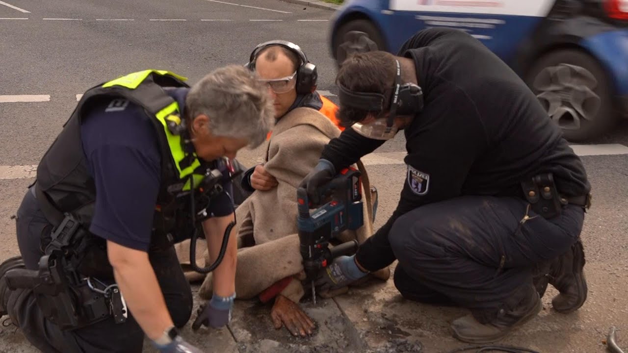 Berlin police struggle to free superglued activist