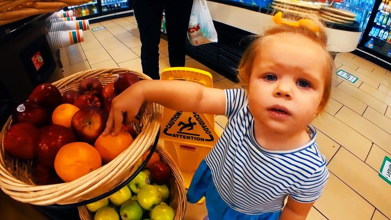 Naomi is having a fun shopping trip with her dad at the grocery store.