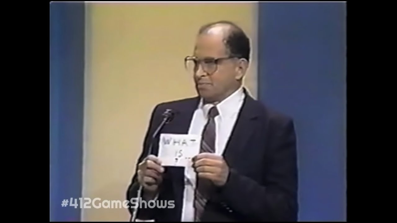 Lionel Goldbart’s friends give him a “WHAT IS…?” Card