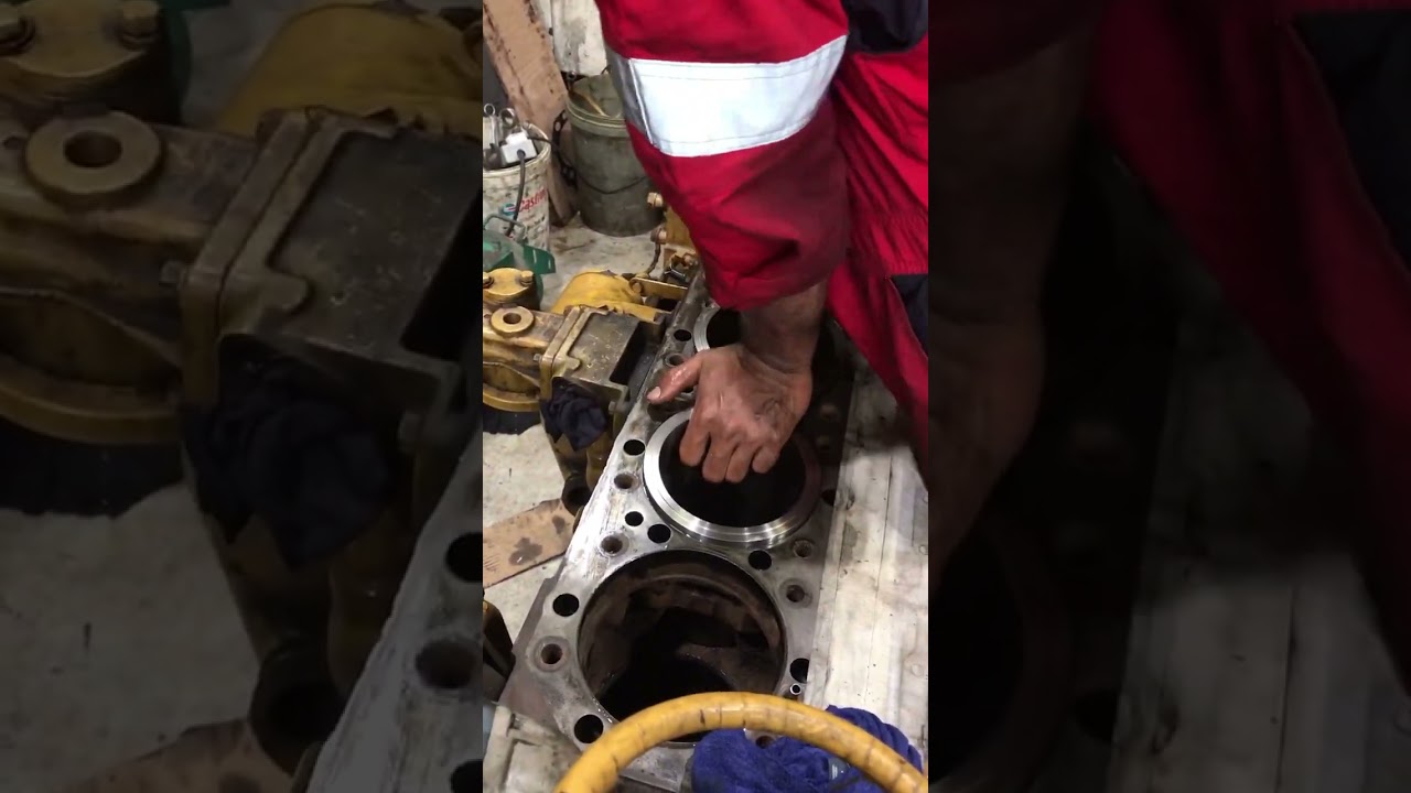 CAT engine cylinder liner installation