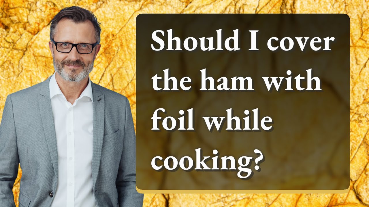 Should I cover the ham with foil while cooking?