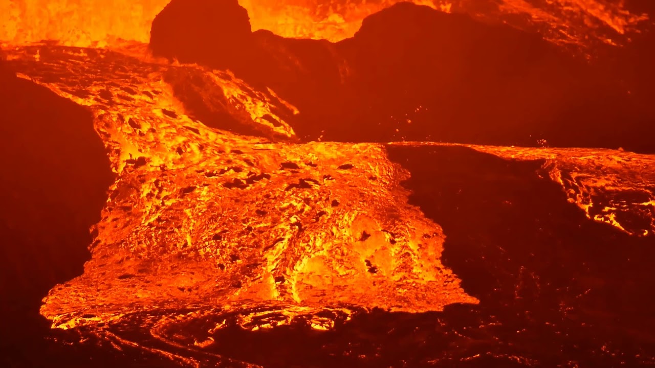 Lava flows out of the side of its channel, near crater 19 July 2021, Fagradalsfjall volcano ,Iceland