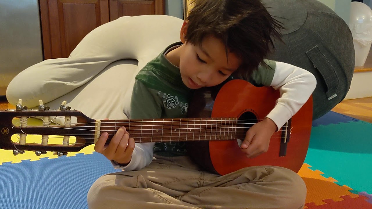 Xavier on his new half scale guitar - no more wiggly body!