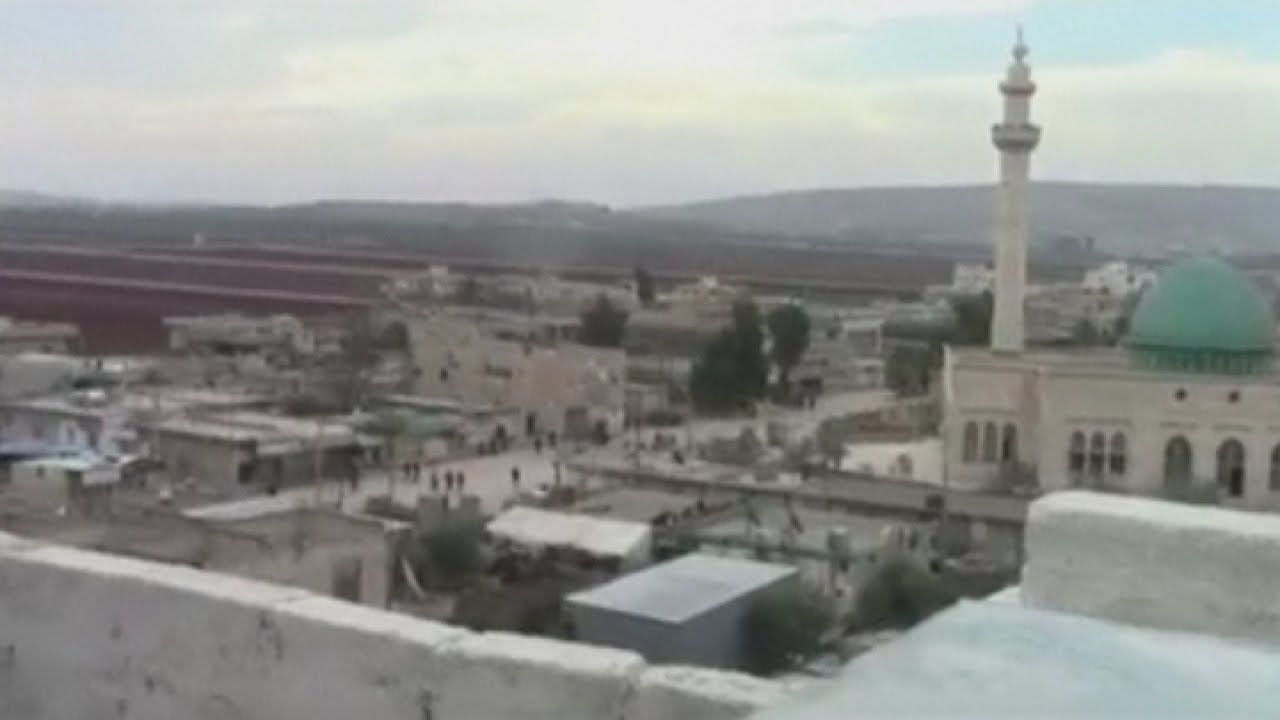 Syria rebels clash with militants as buildings are shelled