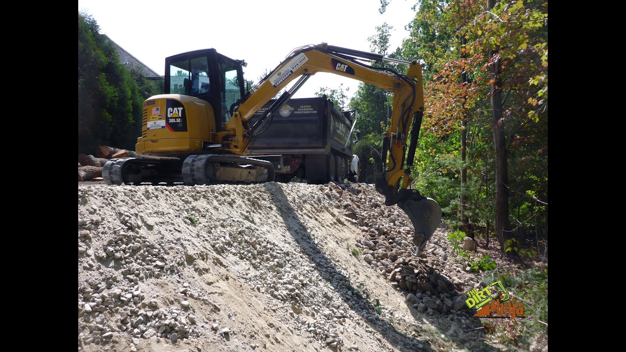 Cat 305.5e2 Placing Erosion Stone