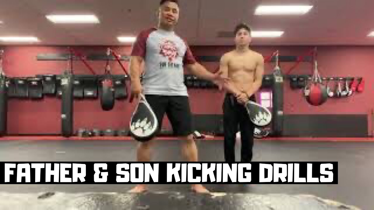 Father & Son basic kicking drills on the kick paddles.