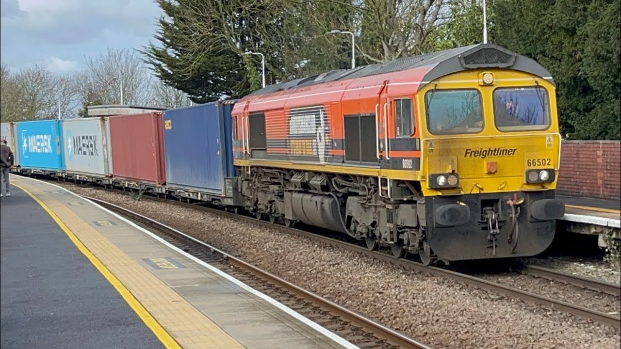 An orange 🍊”Andy's man club it's okay to talk” 66502 4L73 21 containers 12;37 5E Lea Road 28/2/2026