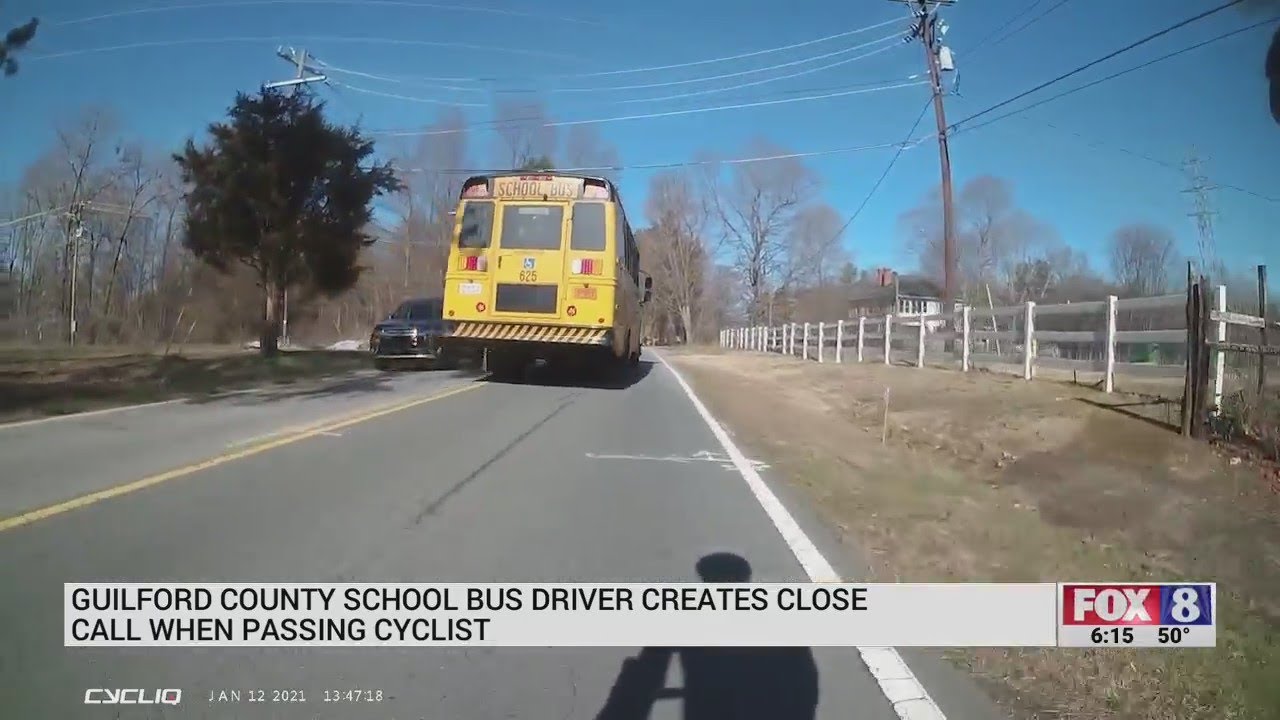 Guilford County Schools bus driver causes close call while passing cyclist