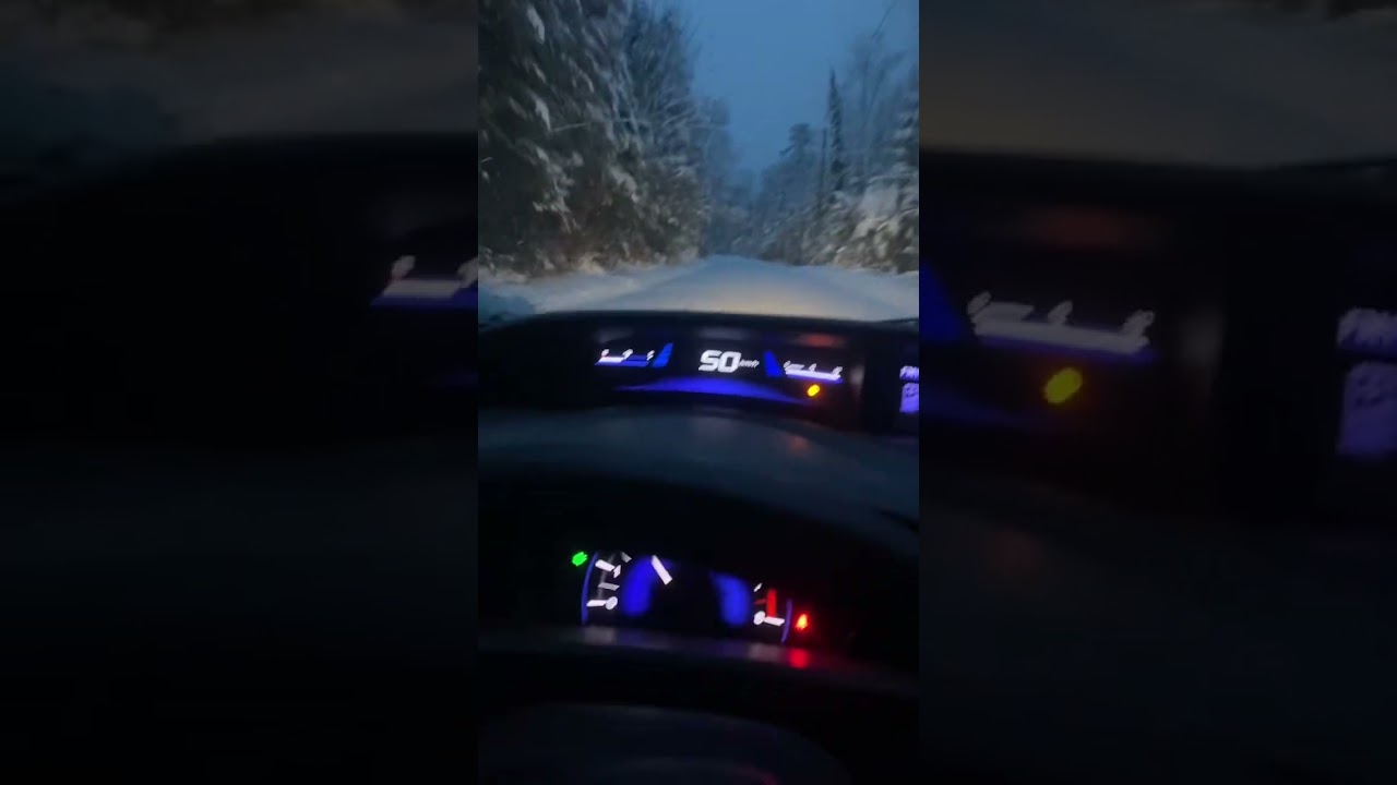 Honda Civic plowing through a foot of snow 