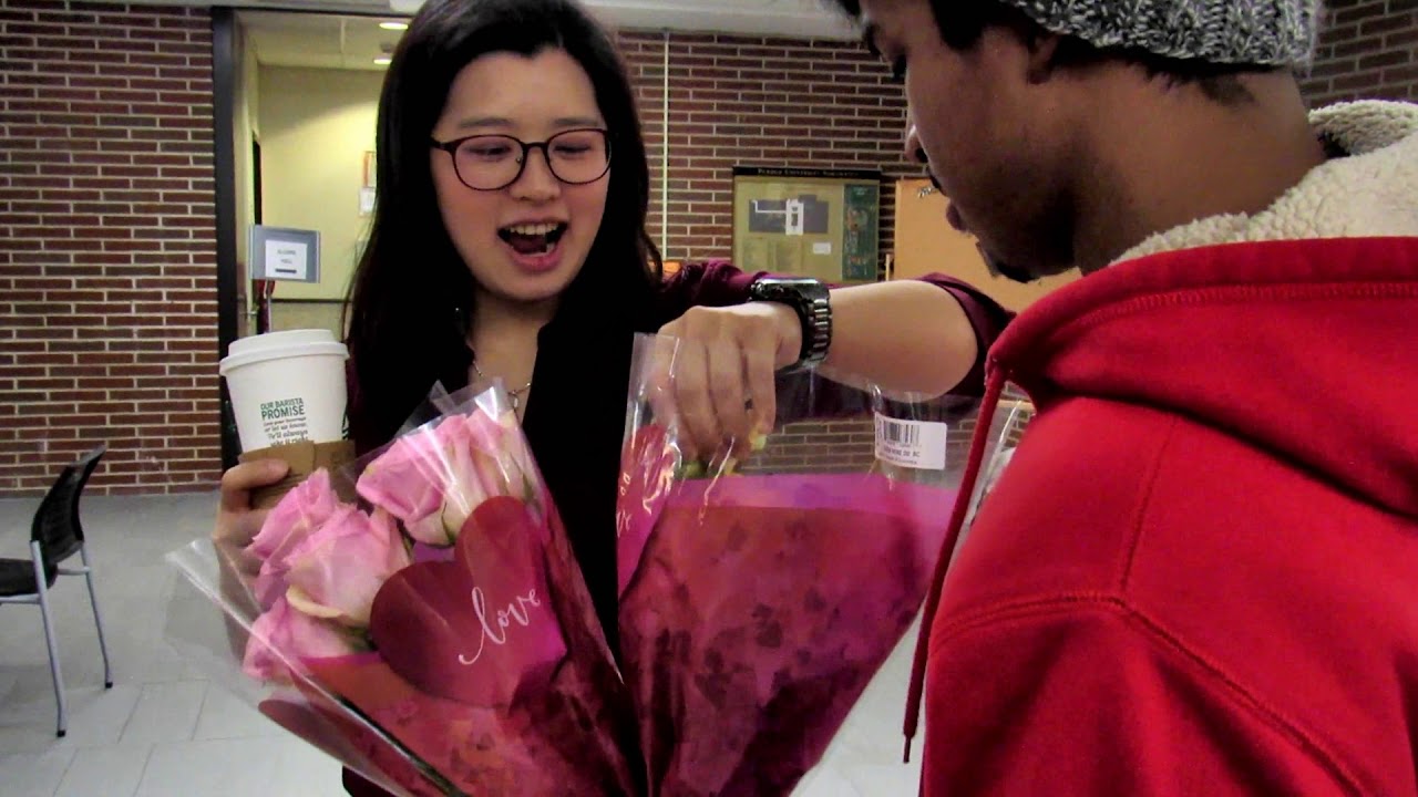 Giving Girls  Roses for Valentine's Day at  my School.