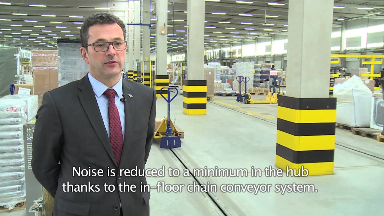 In-floor chain conveyor (E'tow) crossdocking system at Koch International Osnabrück by Dematic NV